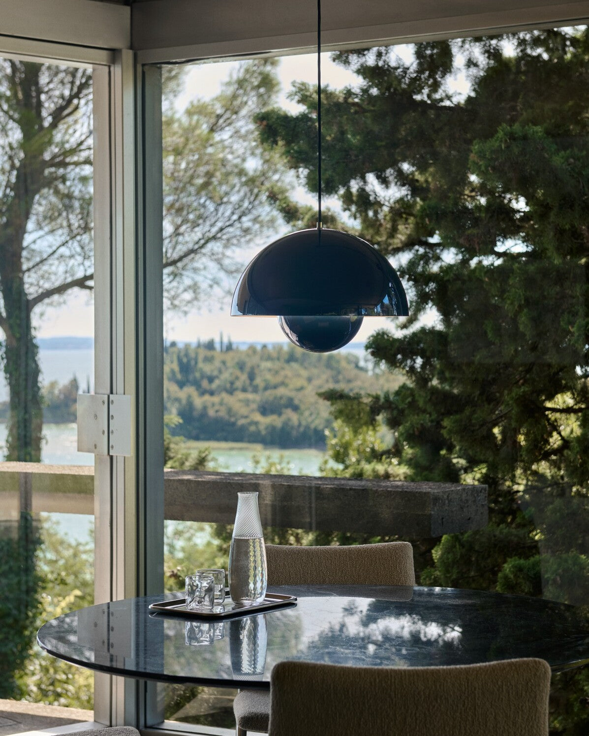 Black &Tradition Flowerpot pendant above a round dining table.