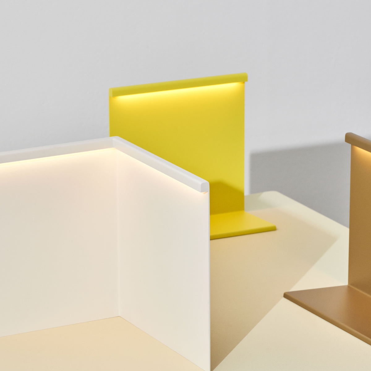 HAY LBM Corner Table Lamp in cream white with a titanium yellow LBM Table Lamp; two-model context