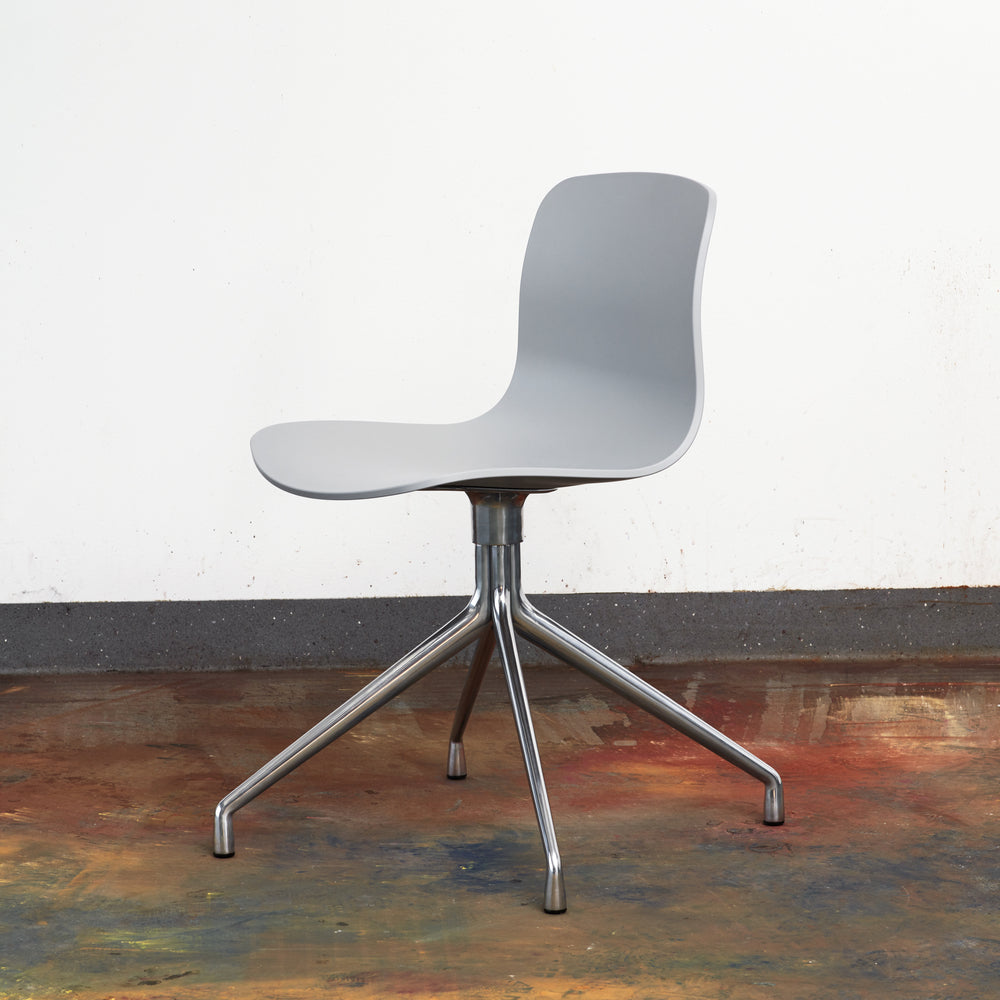 HAY manufacturer lifestyle photograph: AAC 10 concrete grey 2.0 shell aluminium base