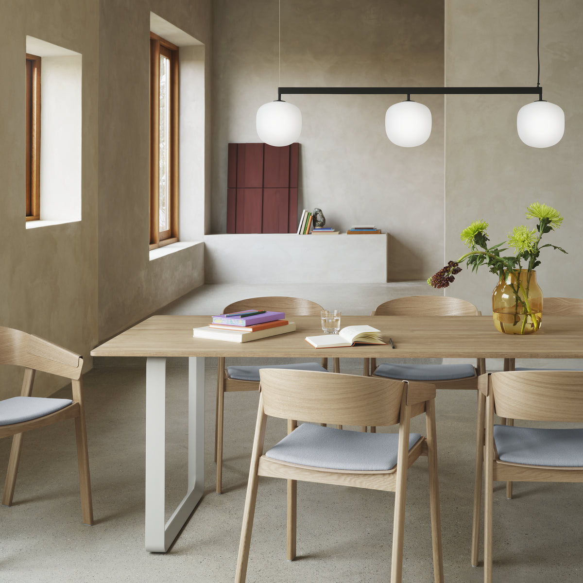 Muuto 70/70 Table 225 x 90 cm in solid oak with grey legs, with Cover armchairs beneath a Rime Rail lamp
