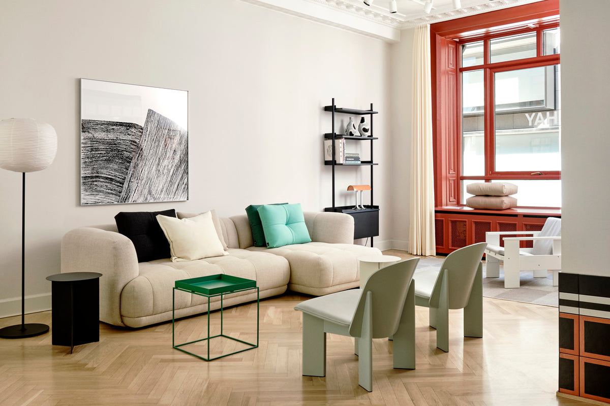 A room with HAY Quilton sofa and Chisel lounge chair