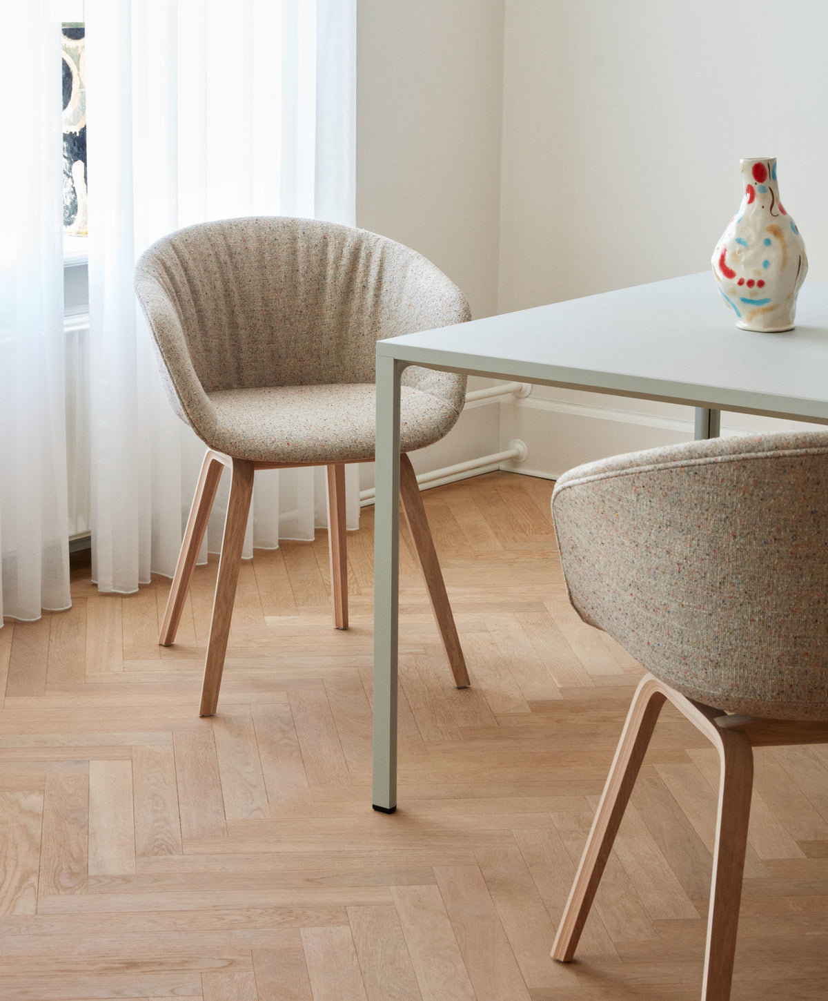 HAY AAC 23 Soft in Bolgheri upholstery with lacquered oak legs beside a New Order table