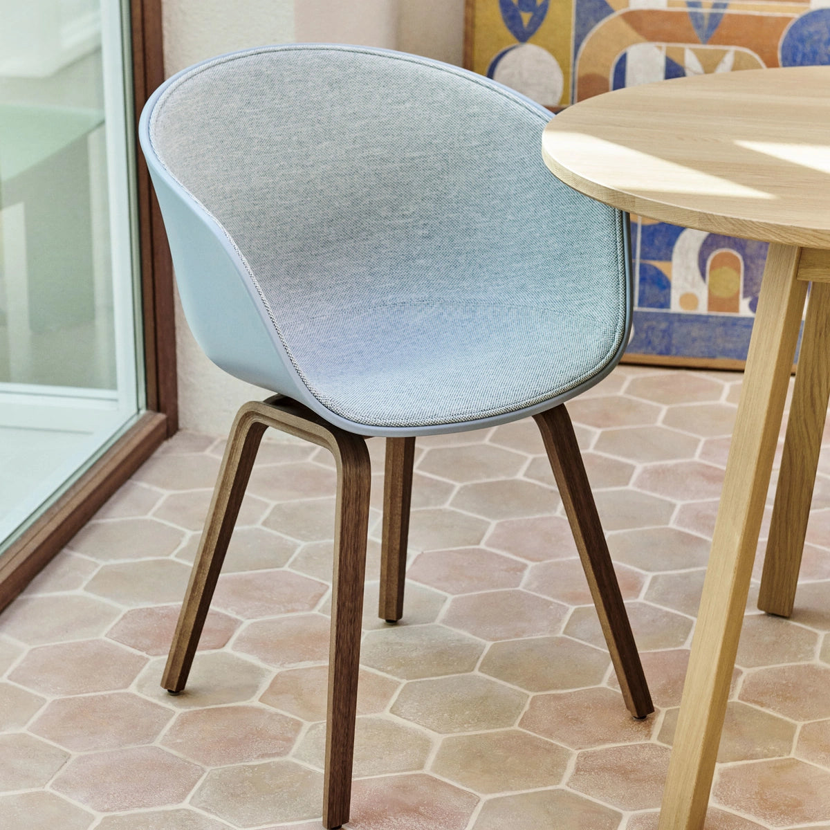 Family context: HAY AAC 22 front-upholstered chair at a Triangle Leg Table