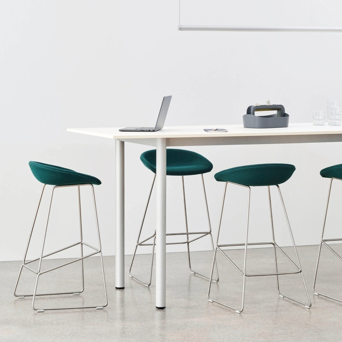 Family context: HAY AAS 39 High fully upholstered stools in Autumn 0971, with stainless steel bases, around an Annex table.