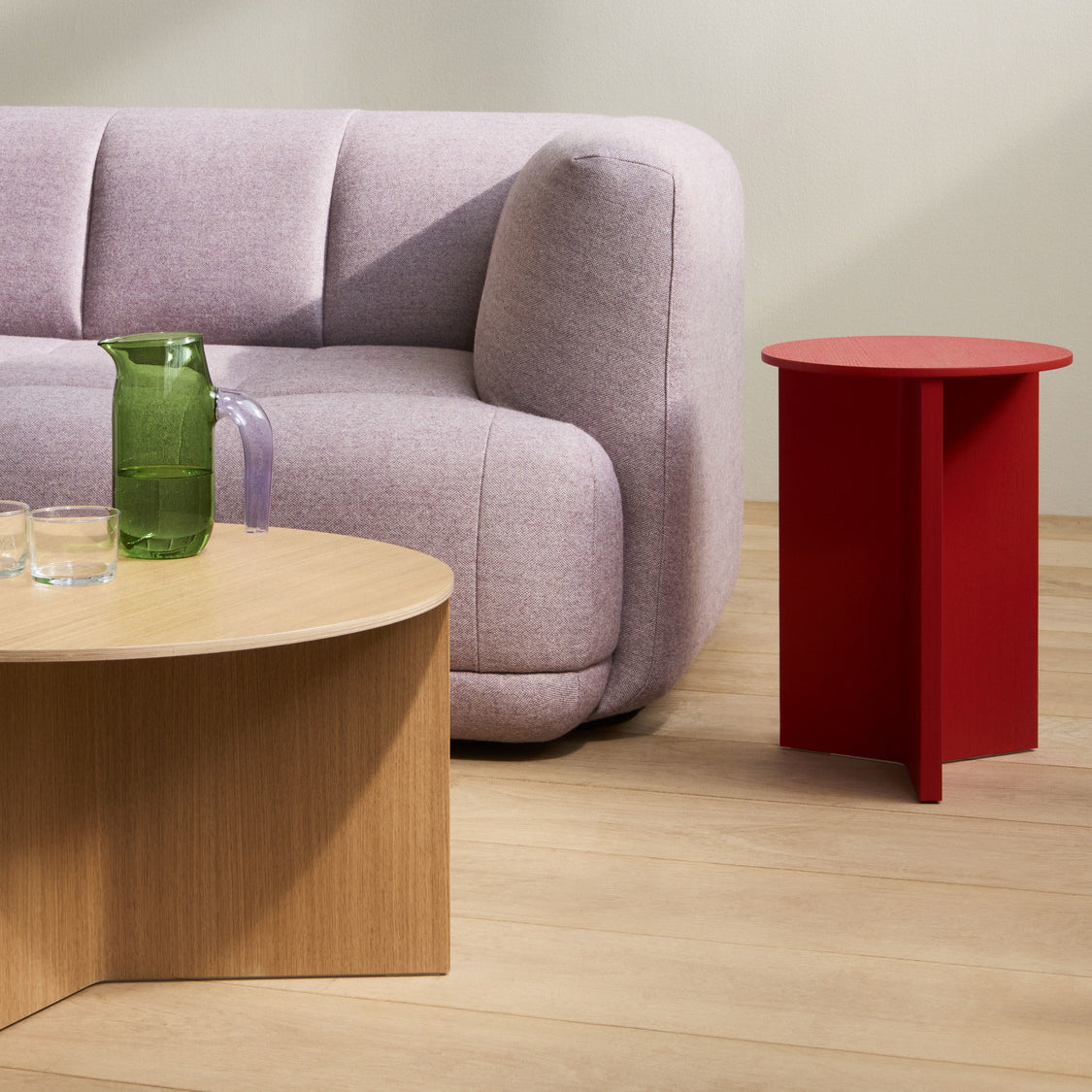 Family context — room detail: HAY Quilton comb 19 Left Metaphor 044, Slit Table Wood Round High candy red water-based lacquer oak, Slit Table Wood Round XL water-based lacquer oak