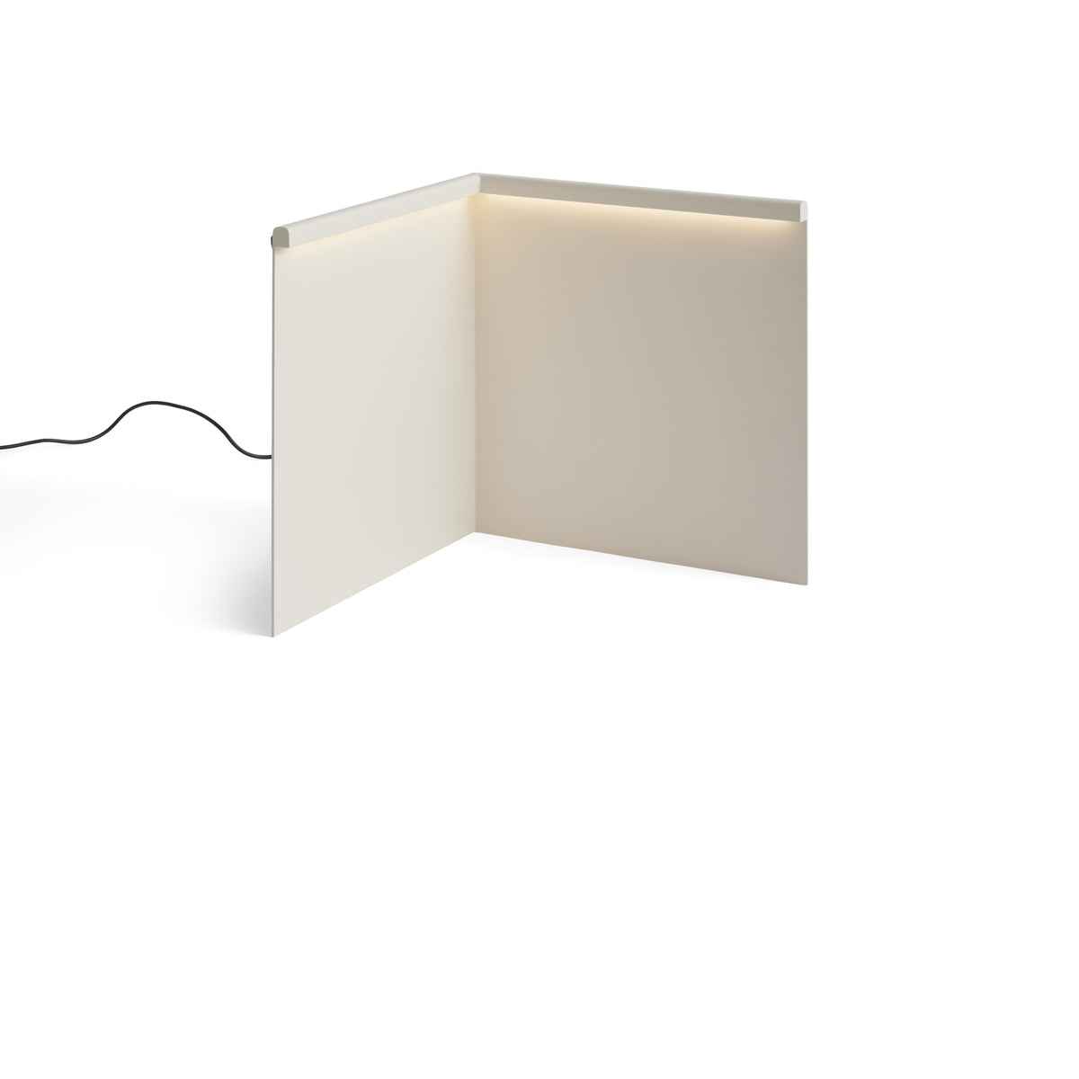 HAY LBM Corner Table Lamp in cream white illuminated, with cable continuing beyond the source frame