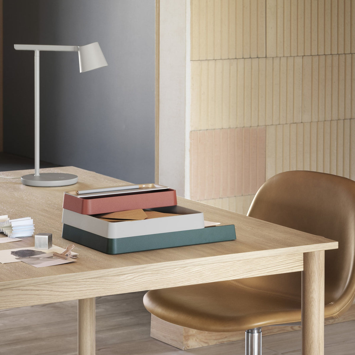 Muuto Tip lamp and Arrange trays on a timber desk