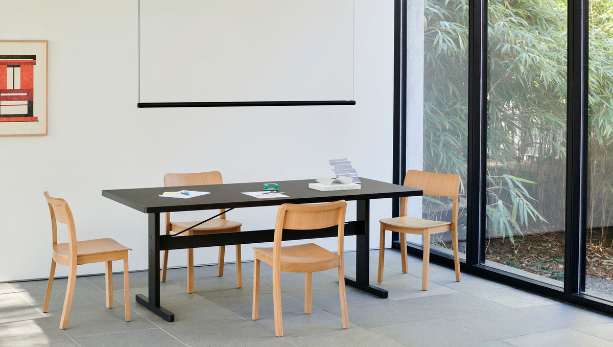 HAY Passerelle table with Pastis chairs in a dining space