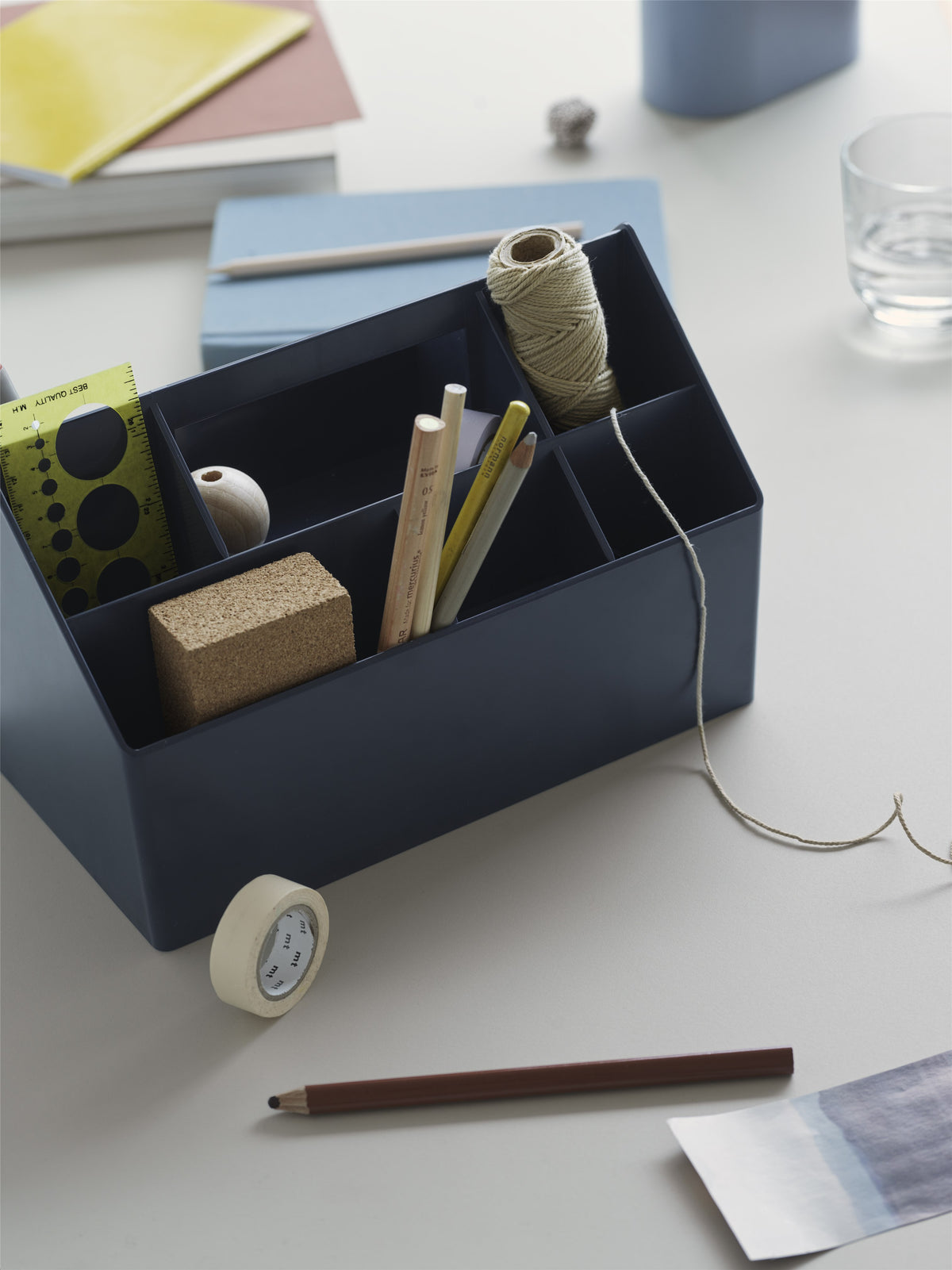 Muuto Sketch Toolbox holding stationery on a desk